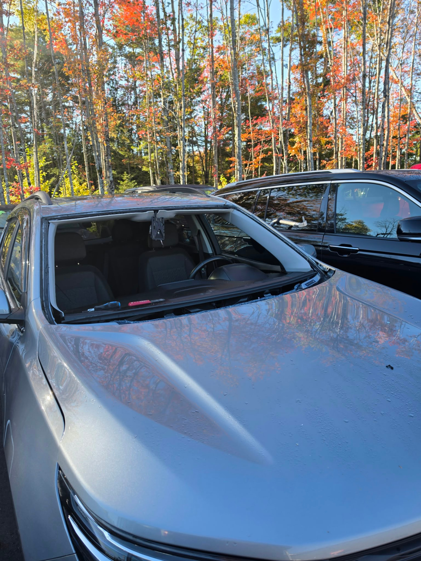 Windshield removal in progress on a Chevrolet